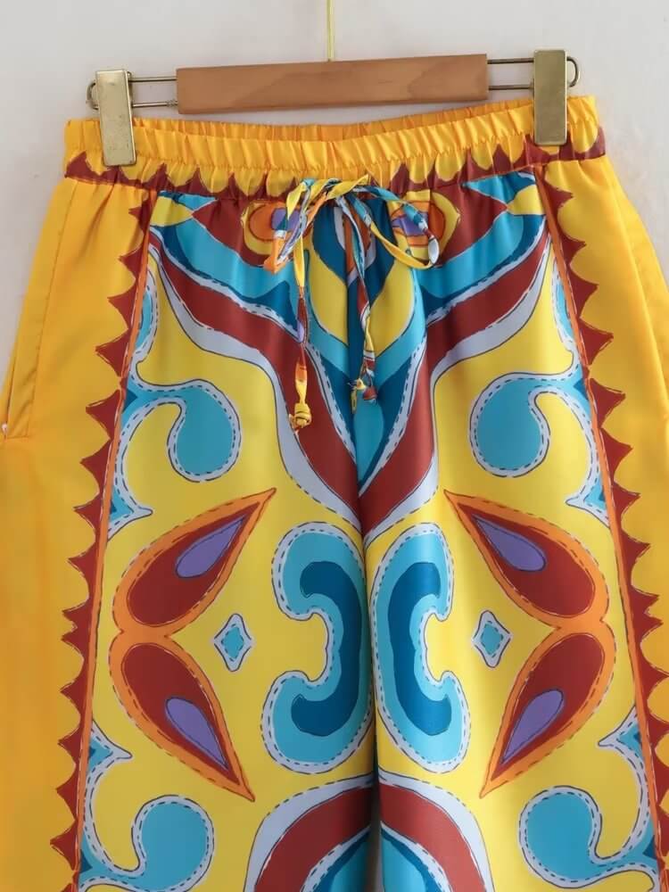 Patterned yellow satin pants