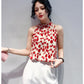 Red patterned sleeveless satin blouse