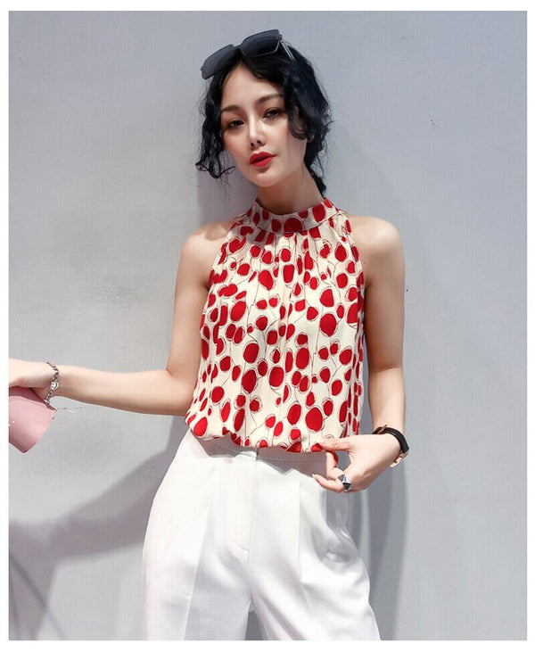 Red patterned sleeveless satin blouse
