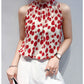 Red patterned sleeveless satin blouse