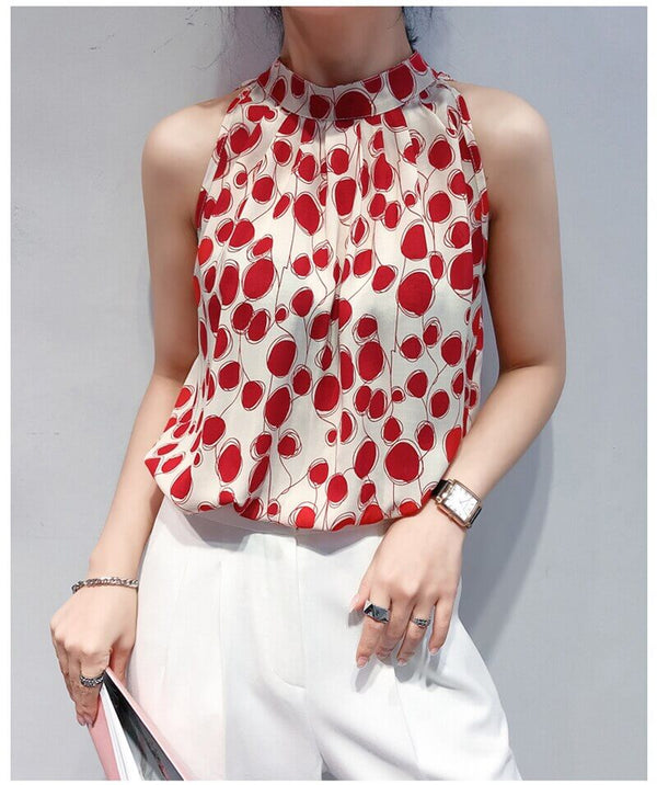 Red patterned sleeveless satin blouse