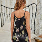 Pyjama noir avec des fleurs roses et vertes en satin